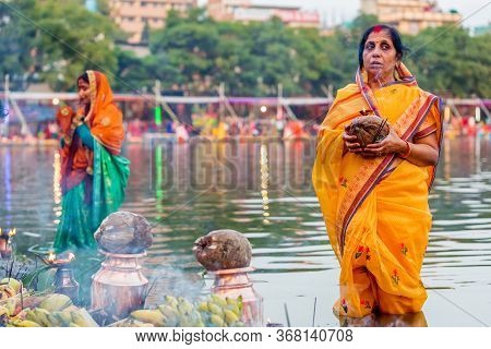 Kathmandu,nepal - November 1,2019: Hindu Devotees Offering Prayers To Sun God Standing In Water Acco