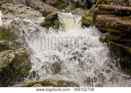 River Forming Waterfalls In Cetatile Ponorului, Apuseni Natural Park, Romania