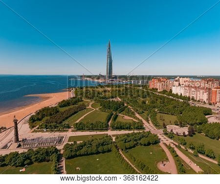 Beautiful Green Park In St. Petersburg. Tower Lakhta Center And The Gulf Of Finland. Aerial Shot