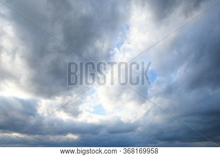 Stormy Sky With Storm Clouns On The Sunset With Beautiful Sun
