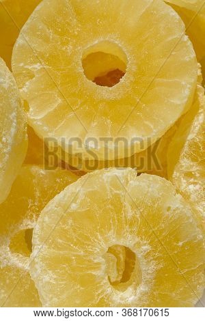 Dried Pineapple Candy Rings, In Powdered Sugar, Close-up.