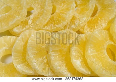 Dried Pineapple Candy Rings, In Powdered Sugar, Close-up In Sunlight.