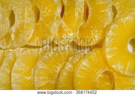 Dried Pineapple Candy Rings, In Powdered Sugar, Close-up In Sunlight.