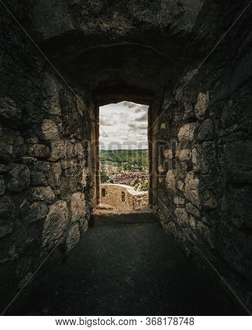 Dark Stone Window Of The Castle Hohenurach With View To The Town Bad Urach