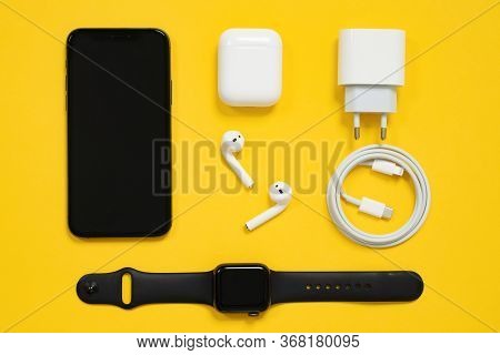 May 01, 2020, Rostov, Russia:  Set Of Apple Devices, Black Iphone And Applewatch, White Airpods With