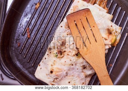Shaverma In Homemade Lacais Rests On A Grilled Wooden Spoon