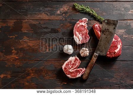 Mix Various Cowboy Chuck Eye Roll Delmonico Steak, Entrecote Which Lies Near The Cutting Knife. Raw 