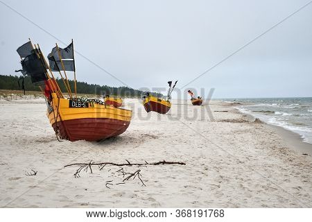 Debki, Poland- May 25, 2020: Fishing Boat On The Beach On A Cloudy And Foggy Day. Baltic Sea, Poland