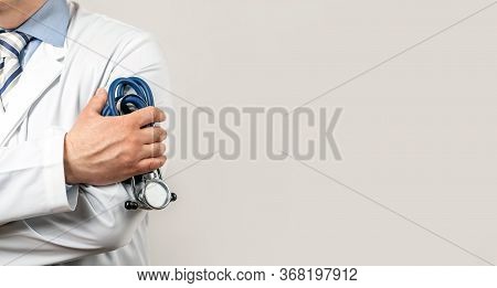 Healthcare And Medical Concept. Medical Doctor With A Stethoscope In His Hand. Male Doctor Pediatric