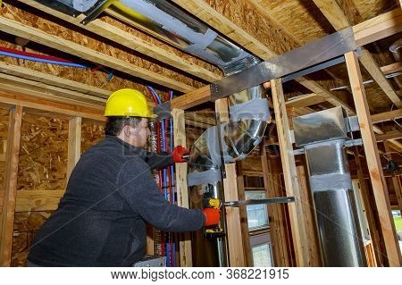 Workers Making Final Air Duct Conditioning Hvac System Ventilation Pipes Stands For Heating