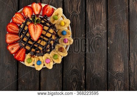 A Top View Sweet Pancakes Yummy Delicoius Along With Sliced Red Strawberries And Bananas Inside Whit
