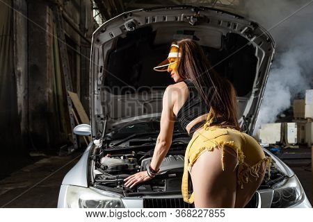 Fashion Photo Of Attractive  Woman With Dark Hair In In Yellow Denim Shorts, Cap And Top  Opened The