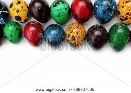 Frame Of Multi-colored Quail Eggs. Multi-colored Quail Easter Eggs On A White Background. Multi-colo
