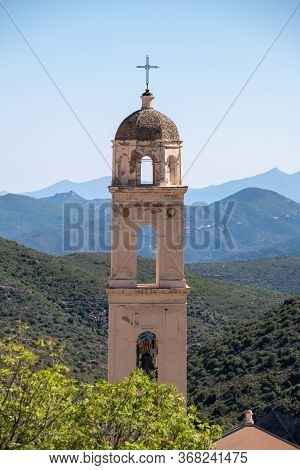 Church Bell Tower With Pebbled Dome In The Ancient Mountain Village Of Palasca In The Balagne Region