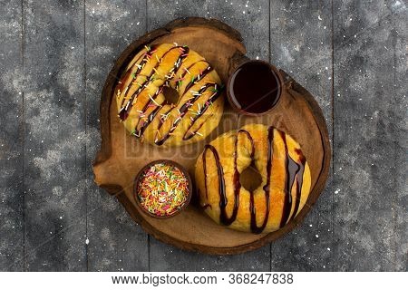 A Top View Donuts Sweet Yummy Delicious On The Brown Desk And Rustic Wooden Floor