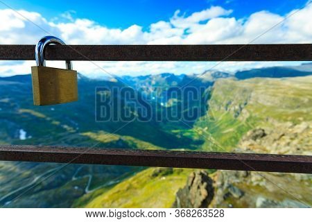 Tourism Vacation And Travel. Lock Padlock On Bridge Rail And Mountains, View Over Geirangerfjorden F