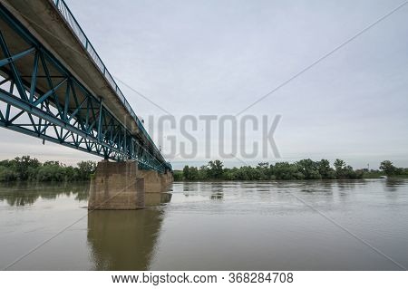 Steel Bridge Crossing The Sava River Between Brcko And Gunja, At The Border Between Bosnia And Herze