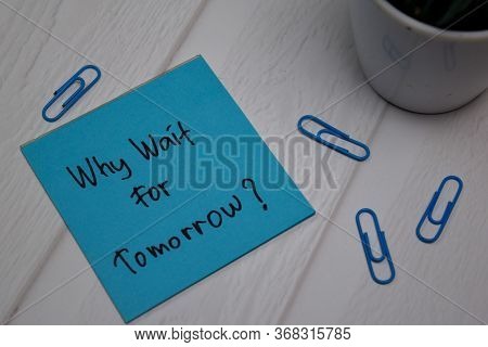 What Wait For Tomorrow Write On Sticky Note Isolated On Wooden Table.