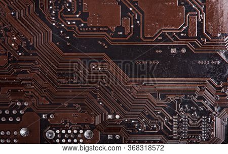 Modern printed brown circuit board, electronic circuit board, textolite. Background banner.