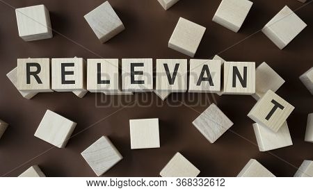 Relevant Word Written On Wood Block, Business And Financial Concept.