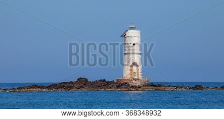 The Lighthouse Of The Boat Eater Of Calasetta, South Sardinia, On A Beautiful Summer Day