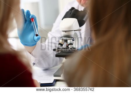 Doctor Patient Blood Sample Front Microscope. Test Results For Coronavirus. Virological Laboratory. 