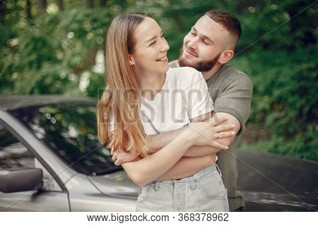 Beautiful Couple Spend Time On A Summer Forest