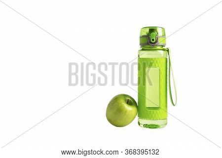One Bright Green Fitness Sport Bottle Or Flask With Dispenser And Water And Fresh Apple On Isolated 