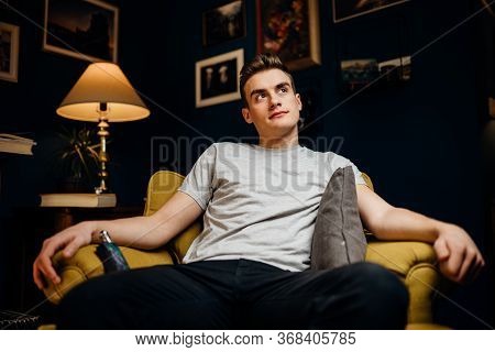 Stressed Man Overthinking Events Alone At Home.thinking Of Problems.concentration Problems.brain/cog