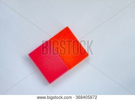 2 Orange And Red Wisps For Cleaning  On A Grey Background
