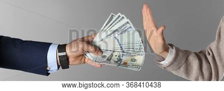 Woman Refusing To Take Bribe On Grey Background, Closeup. Banner Design