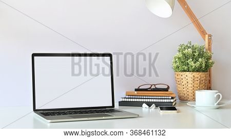 ฺblank Screen Laptop And Office Equipment Is On The Table. Modern Working Desk Concept.
