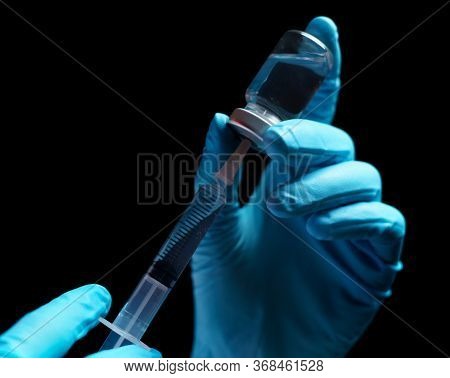 Doctor Hand Holding Coronavirus Vaccine Shot For Diseases Outbreak Vaccination, Medicine And Drug Co