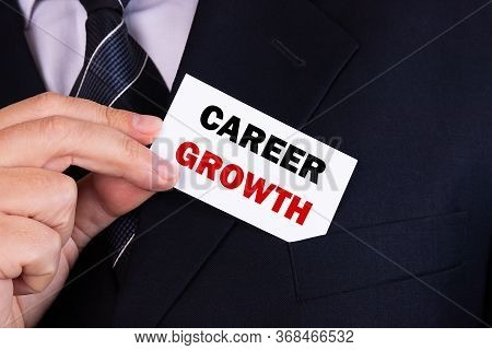 Businessman Put Card With Text Career Growth In Pocket. Business Concept.