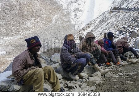 Daily Wages Workers Waiting For Transportation Near Khardungla Pass At 18,000 Feet, Leh Ladakh City,