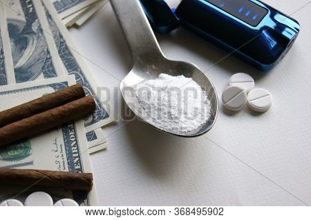 Drugs, Cigars And Money On A White Background. Addiction Concept
