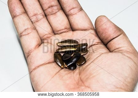 A Picture Of Chikoo Seeds With Selected Focus