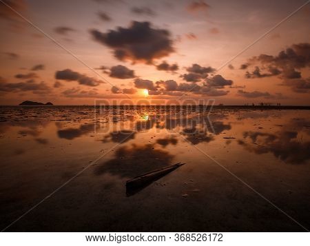 A Tropical Island Sunset With Reflection On Water - Koh Phangan / Thailand