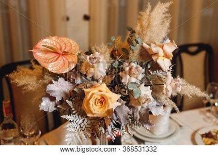 Wedding Banguet Served Table Before Selebration. Wedding Floristics Arrangement On The Table. Festiv