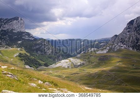 Durmitor Ring Road Panorama In Montenegro National Park. Scenic Landscape Of High Mountains, Green A