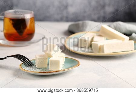 A Delicious, Delicate, Low-calorie Vanilla Pastila (marshmallows) Dessert With A Cup Of Black Tea.