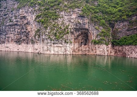 Wushan, Hubei, China - May 7, 2010: Wu Gorge In Yangtze River. Cave Hole Barely Above Green Water In