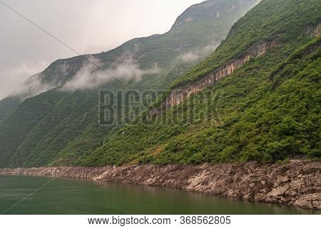 Wushan, Hubei, China - May 7, 2010: Wu Gorge In Yangtze River. Gray Clouds Descend Along Green Fores
