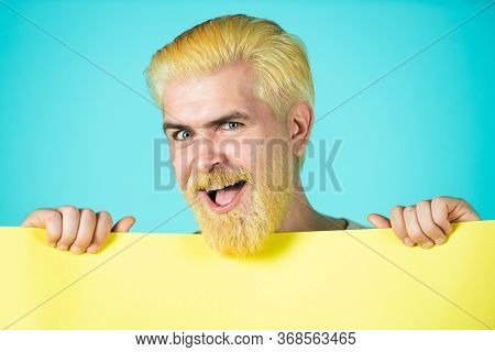 Funny Man Holding A Blank Banner And Looking Down To Copy Space. Business Content Presentation. Man 