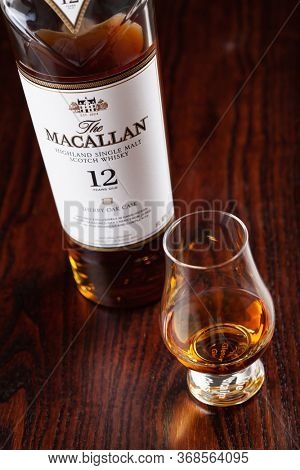 Trondheim, Norway - Mai 19 2020: Macallan single malt scotch whisky 12 years bottle and glass