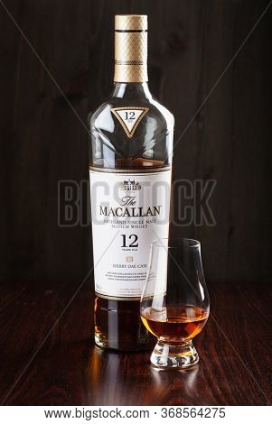 Trondheim, Norway - Mai 19 2020: Macallan single malt scotch whisky 12 years bottle and glass
