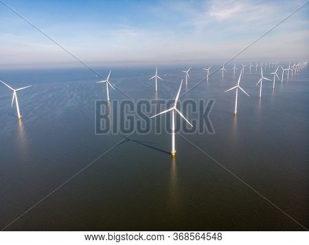 Windmill Park Westermeerdijk Netherlands, Wind Mill Turbine With Blue Sky In Ocean, Green Energy