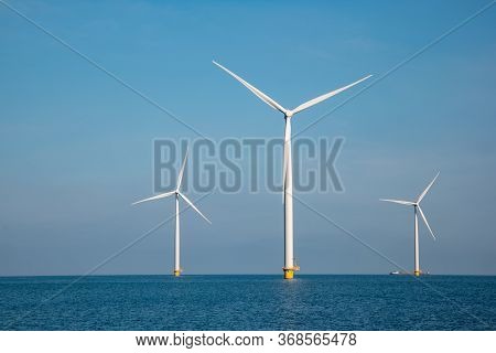 Windmill Park Westermeerdijk Netherlands, Wind Mill Turbine With Blue Sky In Ocean, Green Energy