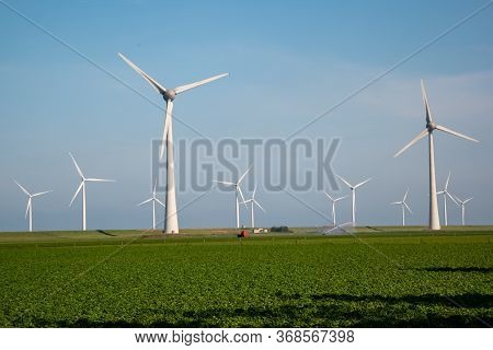Windmill Park Westermeerdijk Netherlands, Wind Mill Turbine With Blue Sky In Ocean, Green Energy