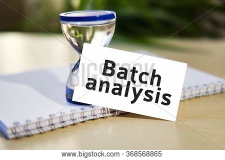 Batch Analysis - Business Seo Concept Text On A White Notebook And Hourglass Clock, Green Leaves Of 